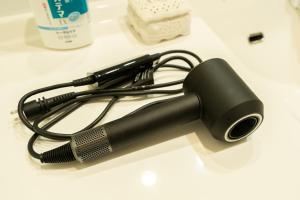 a black flashlight sitting on a white counter at 絆Kizuna in Yatomi 