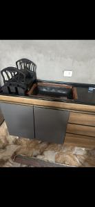 a stove top oven sitting on top of a counter at Casa para carnaval in Marechal Deodoro