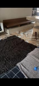a living room with a rug on the floor at Casa para carnaval in Marechal Deodoro