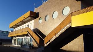 a building with a staircase on the side of it at Suites EL FARO San Carlos in San Carlos