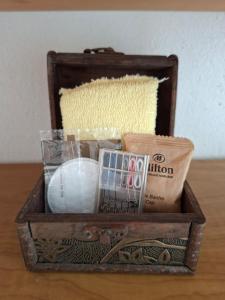 a wooden box with various items in it on a table at Casa Adonai in Temixco