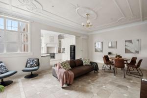 a living room with a couch and a table at 53 Malop by Regional Escapes in Geelong