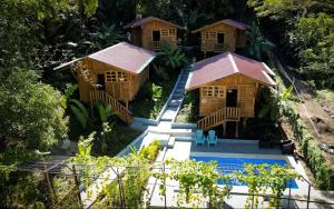 an aerial view of a resort with a swimming pool at Cabañas Samara Buenavista in Sámara