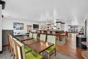 a dining room and kitchen with a table and chairs at Hotel SLC in Salt Lake City