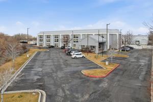 an empty parking lot in front of a building at Hotel SLC in Salt Lake City