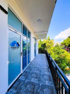a walkway leading to the front of a building at Cloud View Family Villa in Kandy