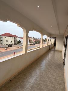 an empty hallway with a view of a street at Room 18 in Brusubi