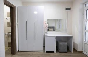 a white bathroom with a sink and a mirror at Zlatni Klas in Zrenjanin +36 photos