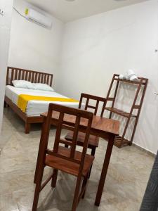 Hotel AF 7 tesisinde bir odada yatak veya yataklar