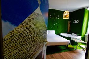 Posteľ alebo postele v izbe v ubytovaní Jacuzzi Rooms