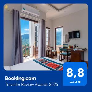 a hotel room with a bed and a desk and a window at Le Boutique Sapa Hotel in Sapa