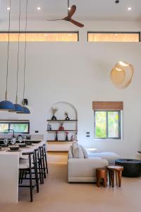 a living room with a couch and a table at NOBELLA Villa, Luxury Boutique Hotel in Ko Phangan