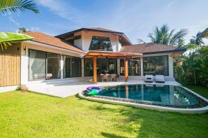 a house with a swimming pool in the yard at NOBELLA Villa, Luxury Boutique Hotel in Ko Phangan
