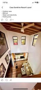 a view of a living room with a ceiling at Casa Sandrine Resort in Malolos