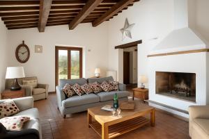 a living room with a couch and a fireplace at VILLA ADELE - Ville Carborello in Crispiero