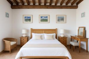 a bedroom with a bed and a desk and a mirror at VILLA ADELE - Ville Carborello in Crispiero