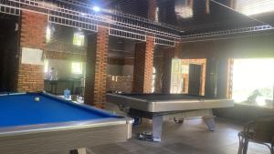 a billiard room with a pool table in it at Askara Toba Cottage in Tuktuk Siadong +4 photos