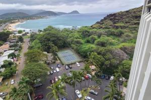 an aerial view of a parking lot next to the ocean at 305 On the Beach in Waianae