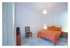 Postel nebo postele na pokoji v ubytování Hostal La Posada