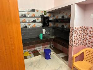 a small kitchen with a sink in a room at Jacobs Cottage KG-F1 in Thiruchendur