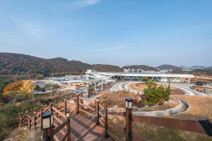 a view of a road with a bridge in the background at Hotel Hills in Paju