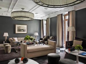 a living room filled with furniture and a large window at Hotel Único Madrid, Small Luxury Hotels in Madrid