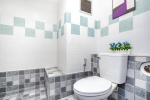 a bathroom with a toilet and a sink at Hua Hin Condo B - Maysa & Hin Nam in Hua Hin