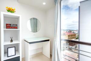 a white room with a window and a sink at Hua Hin Condo B - Maysa & Hin Nam in Hua Hin