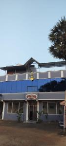 a building with a star on the front of it at Riyanhouse in Pūrnānkuppam