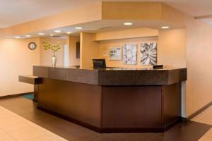 a lobby of a hospital with a reception counter at PrimeStay Extended Suites by IHG in Madison +21 photos