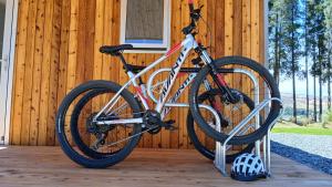 a bike is parked on a porch of a house at The Claim Accommodation in Cromwell