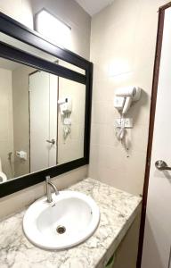 a bathroom with a sink and a mirror at Amazing Inn Koh Phangan in Thong Sala +26 photos
