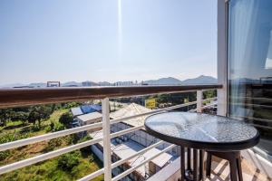 a balcony with a table and a view at Hua Hin Condo C - Maysa & Hin Nam in Hua Hin