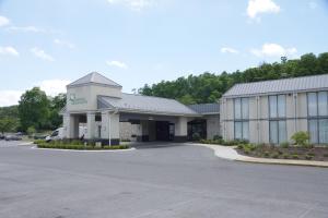 a large building with a parking lot in front of it at Altoona Grand Hotel in Altoona