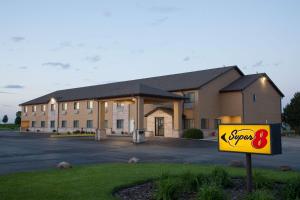 a large building with a sign in front of it at Super 8 by Wyndham Dwight in Dwight