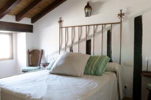 Un pat sau paturi într-o cameră la Palacio Rejadorada