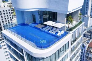 a swimming pool on top of a building at Adamas Boutique Hotel Nha Trang in Nha Trang