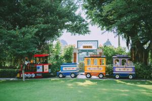 a toy train is parked in a park at Shangri-La Guilin in Guilin
