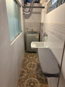 a small bathroom with a sink and a toilet at Kennedy Guest House in Cusco +63 photos