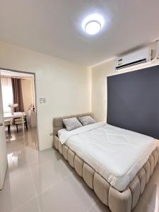 a bedroom with a large bed in a room at Casa Solara in General Santos