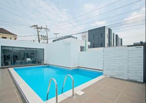 a swimming pool on the side of a building at Home helpers in Lagos