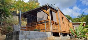 a house being built on top of a retaining wall at Les chalets de la mare in Entre-Deux