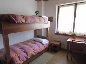 Postel nebo postele na pokoji v ubytování Casa Alpina Don Guanella