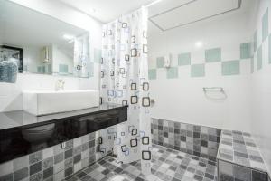 a bathroom with a sink and a toilet and a shower at Hua Hin Condo D - Maysa & Hin Nam in Hua Hin