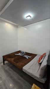 a bedroom with a large bed with at Fab's Spot El Nido in El Nido
