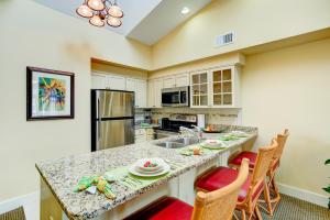 a kitchen with a large island with a counter top at Turtle Cay Resort in Virginia Beach