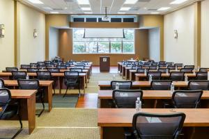 an empty lecture room with tables and chairs at South Shore Harbour Resort and Conference Center in League City