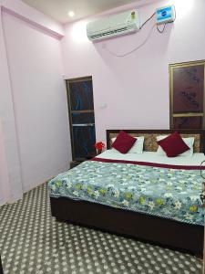a bedroom with a bed in a room at Shri Prabhu guest house in Ayodhya