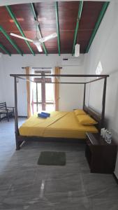 a bedroom with a bunk bed in a room at The Reef Edge in Matara