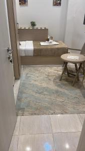 a room with a bed and a table and a table sidx sidx sidx at Crown Home in Cairo +53 photos